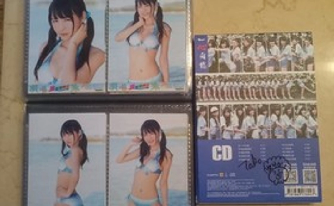 SNH48中古CDアルバム『一心向前（応援盤）』張語格（ヅァン・ユーグァー）サイン入り 1枚　水着生写真4枚コンプリート